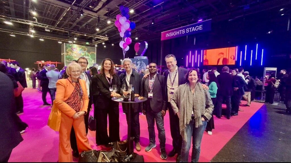 Miguel Oliveira with other participants near the Insights Stage at health.tech global summit 2026 in Basel.